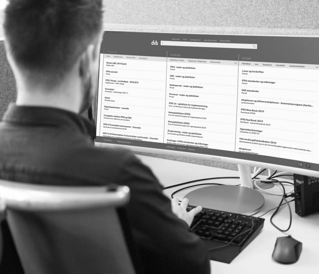 a man infront of computer